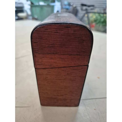 7 - A hinged wooden scent casket containing a set of three perfume bottles