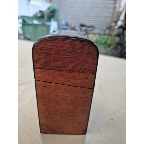 7 - A hinged wooden scent casket containing a set of three perfume bottles