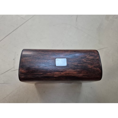 7 - A hinged wooden scent casket containing a set of three perfume bottles