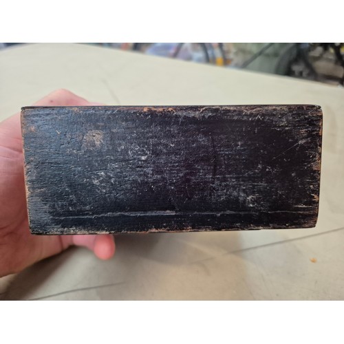 7 - A hinged wooden scent casket containing a set of three perfume bottles