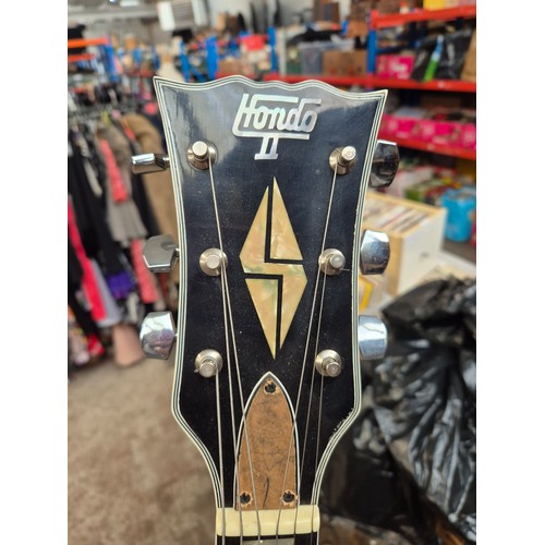 45 - A Hondo II electric guitar with a Linear Linnet Five amplifier