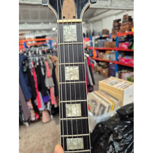 45 - A Hondo II electric guitar with a Linear Linnet Five amplifier