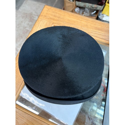 1 - A collection of 9 vintage hats to include bowlers, top hat, and ladies hats