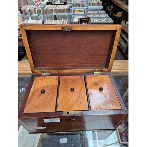 23 - An antique tea caddy with 3 section and an inlaid patera to the lid