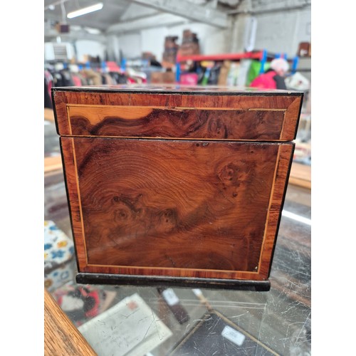 23 - An antique tea caddy with 3 section and an inlaid patera to the lid