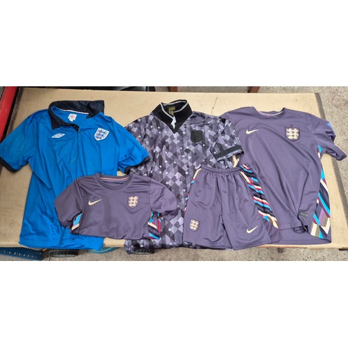 45 - A box of assorted football shirts, training tops & coats to include Manchester United, Blackburn Rov... 