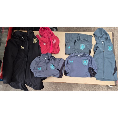 45 - A box of assorted football shirts, training tops & coats to include Manchester United, Blackburn Rov... 