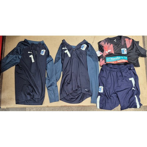 45 - A box of assorted football shirts, training tops & coats to include Manchester United, Blackburn Rov... 