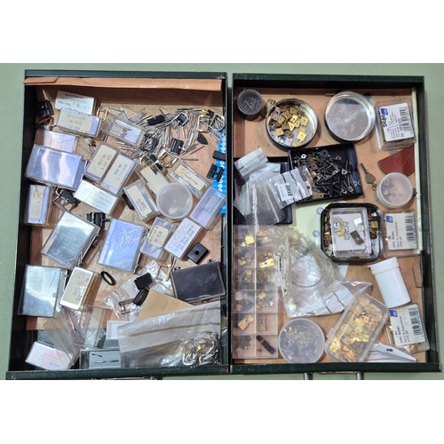 10 - A green metal four drawer filing cabinet containing watch and clock spares.