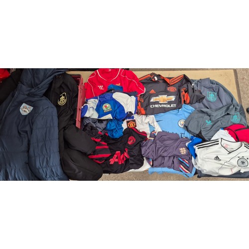 45 - A box of assorted football shirts, training tops & coats to include Manchester United, Blackburn Rov... 