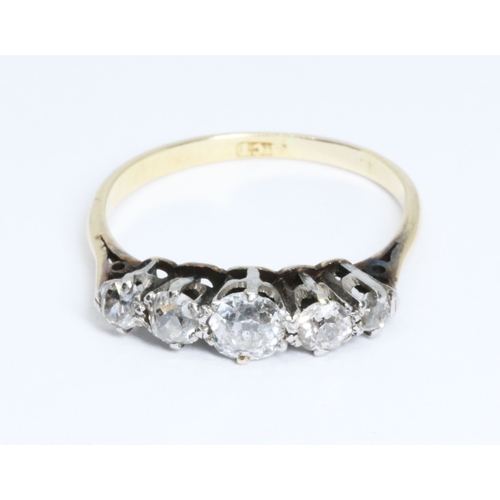 10 - An antique five stone diamond ring, the old cut stones weighing approximately 0.83ct, band indistinc... 
