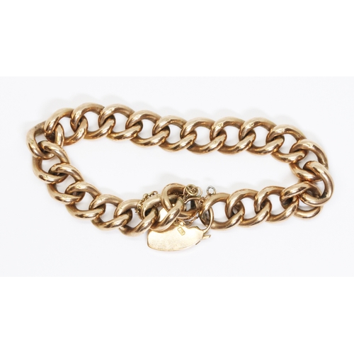 15 - An antique oval link bracelet with heart shaped padlock clasp, marked 'C.F' and '9ct', length 18cm, ... 