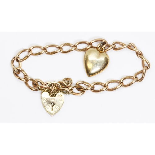 17 - A hallmarked 9ct gold oval link bracelet with heart shaed padlock clasp and heart charm, length 16cm... 