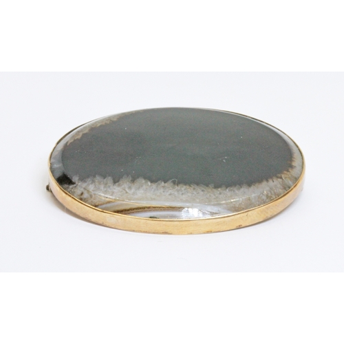 28 - An antique agate cabochon brooch, mounted marked '9ct' with maker's initials 'H.W.ld', gross weight ... 