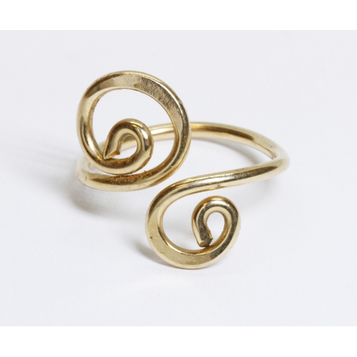 57 - A yellow metal scroll design ring, unmarked, weight 2.2g, size currently O.