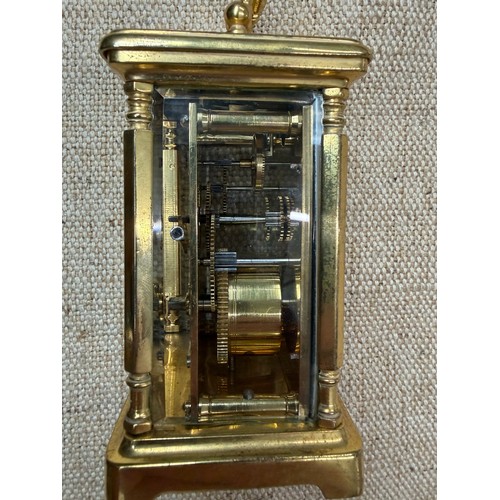 2 - A carriage clock by J Vincent, Weymouth, bearing a Harrods sticker to base, in wooden case