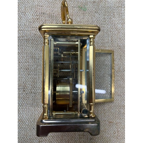 2 - A carriage clock by J Vincent, Weymouth, bearing a Harrods sticker to base, in wooden case