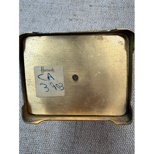 2 - A carriage clock by J Vincent, Weymouth, bearing a Harrods sticker to base, in wooden case