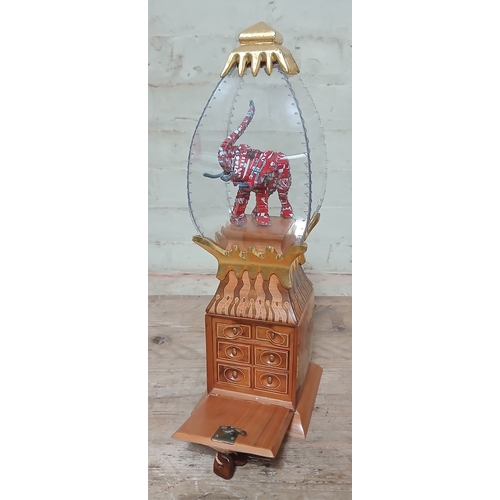 32 - John Southworth Prescott (b1939), untitled, jewellery cabinet, perspex case displaying a metal eleph... 