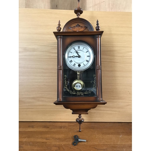 496 - 'Hepa' 15 Day Movement Wall Clock with Key and Pendulum in Decorative Case