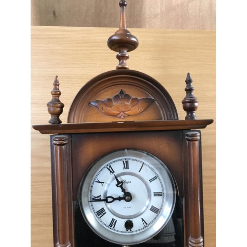 496 - 'Hepa' 15 Day Movement Wall Clock with Key and Pendulum in Decorative Case