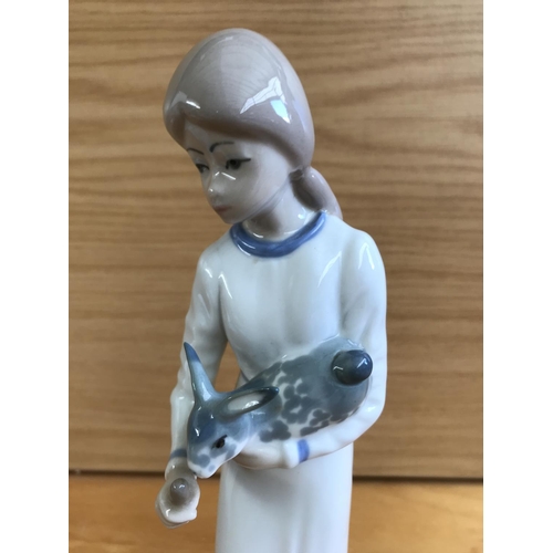 189 - Casades Porcelain Figurine of Girl Feeding Rabbit (22cm H.)