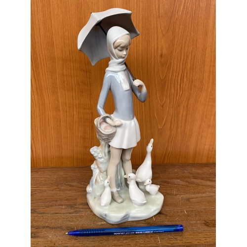 66 - Lladro Porcelain Figurine of Girl with Umbrella and Geese (25cm H.)