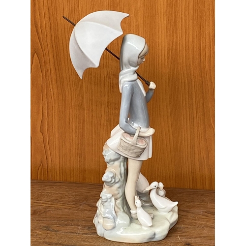 66 - Lladro Porcelain Figurine of Girl with Umbrella and Geese (25cm H.)