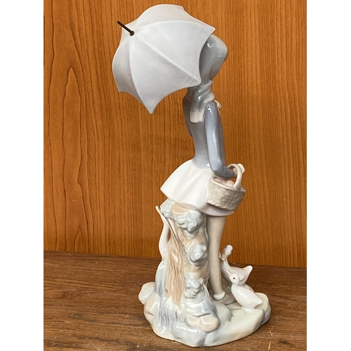 66 - Lladro Porcelain Figurine of Girl with Umbrella and Geese (25cm H.)