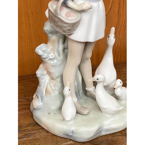 66 - Lladro Porcelain Figurine of Girl with Umbrella and Geese (25cm H.)