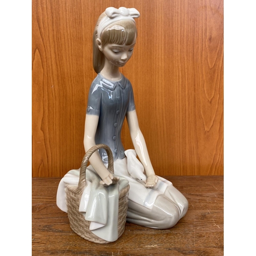 67 - Lladro Girl Sitting with Picnic Basket Feeding Dove Figurine (20cm H.)