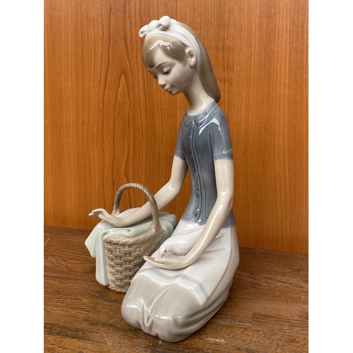 67 - Lladro Girl Sitting with Picnic Basket Feeding Dove Figurine (20cm H.)