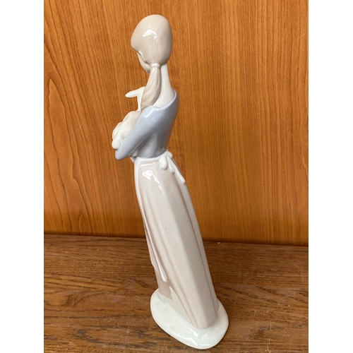 69 - Lladro Figurine Girl Holding a Lamb (26cm H.)