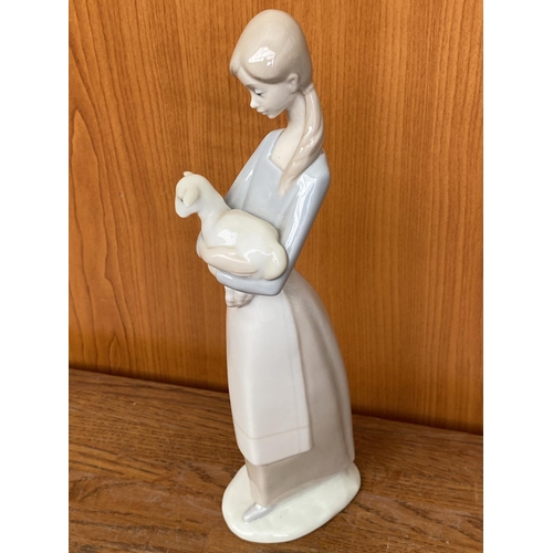 69 - Lladro Figurine Girl Holding a Lamb (26cm H.)