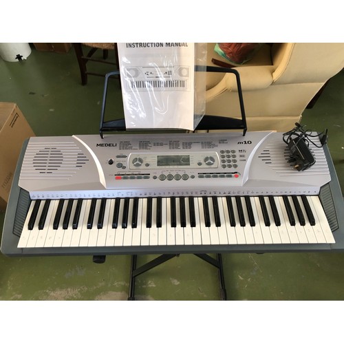 96 - Medeli M10 Electronic Keyboard with 157 Voices and 100 Melodies for Training