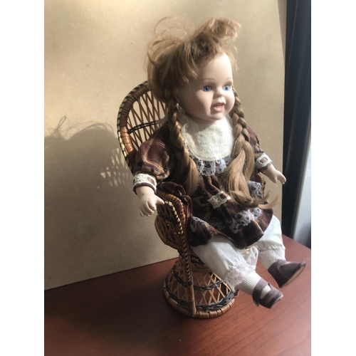 217 - Vintage Large Ceramic Doll on Wicker Chair