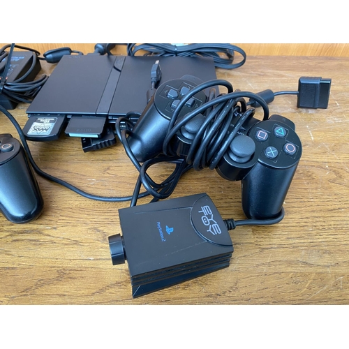 150 - Sony Playstation 2 Slim Console with x2 Wired Game Controller Game Pads, Eye Toy Camera and Game, x4... 