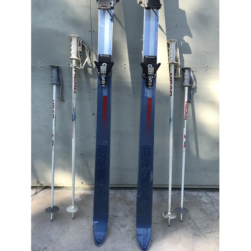 137 - Pair of Head Elite Skis with 4 Sticks