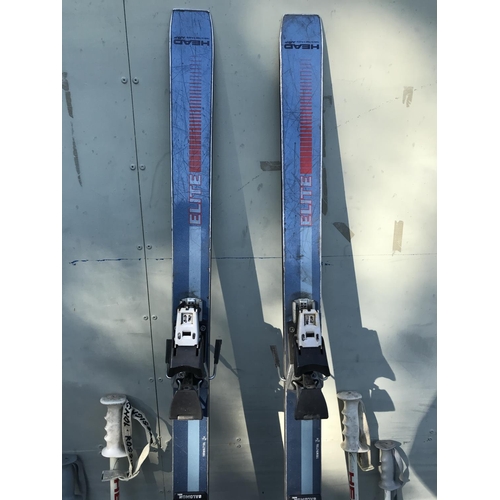 137 - Pair of Head Elite Skis with 4 Sticks