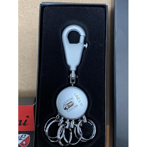 478 - x2 Lamborghini and Troika Key Rings (Unused)