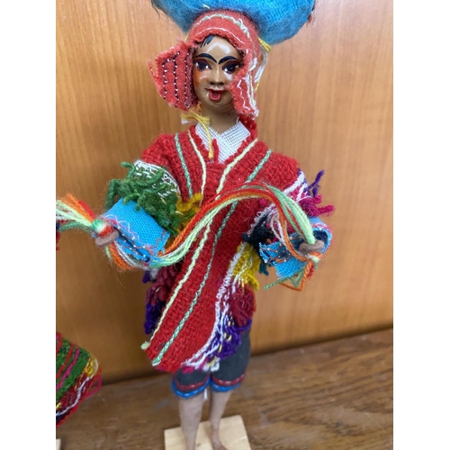 550 - Pair of Peruvian Dolls in National Costumes on Small Wooden Pedestal Taken Back 19/1/24