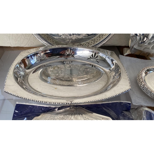 445 - Collection of Silver Plated Items, Round Tray, Bread Basket, x2 Table Mats, 6 Coasters and Napkin Ho... 
