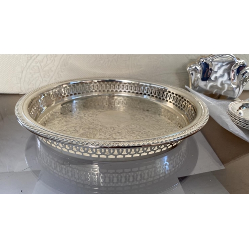 445 - Collection of Silver Plated Items, Round Tray, Bread Basket, x2 Table Mats, 6 Coasters and Napkin Ho... 