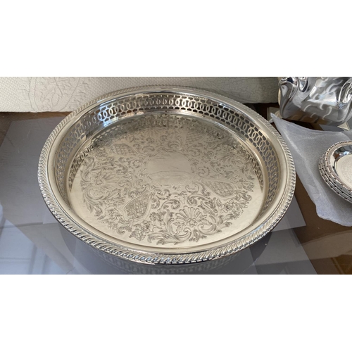 445 - Collection of Silver Plated Items, Round Tray, Bread Basket, x2 Table Mats, 6 Coasters and Napkin Ho... 