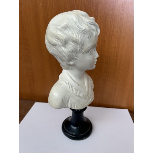 165 - Carved Ceramic Bust of a Boy on Wooden Stand (26cm H.)