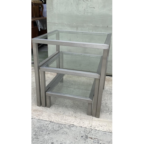 85 - Commercial Heavy Duty Nesting Tables in Brushed Aluminium and Glass (75 W. x 70 D. x 80cm H. Largest... 