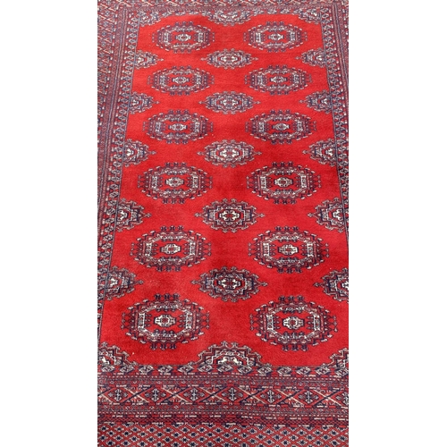 50 - Vintage Bukhara Hand Knitted Rug in Vibrant Red and Traditional Pattern (Tekke Gul Motif)