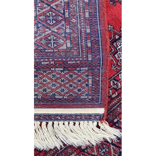 50 - Vintage Bukhara Hand Knitted Rug in Vibrant Red and Traditional Pattern (Tekke Gul Motif)