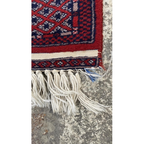 50 - Vintage Bukhara Hand Knitted Rug in Vibrant Red and Traditional Pattern (Tekke Gul Motif)