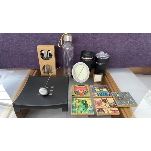 124 - Collection of Assorted Items Incl. Owl Mats, Set od Oil. Vinegar Sprayers, Camera Lens Coffee Travel... 